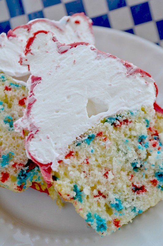 Hi hat cupcake cut in half to show red and blue speckles