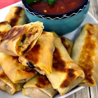 Cheesy Southwest Egg Rolls~Turn this Slow Cooker Creamy Chicken Chili into delicious and mouthwatering Cheesy Southwest Egg Rolls!